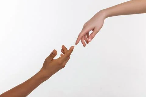 Two different hands recreating famous picture while pulling out Stock Photos
