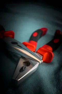 Two different pliers in a dark environment 写真素材