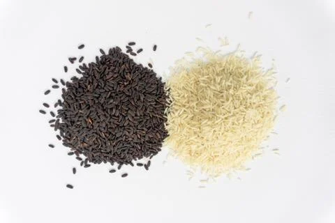 Two different rice varieties mountains. Black and white rice. Stock Photos