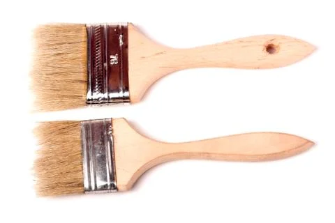 Two different size paint brushes isolated on white background Stock Photos