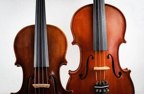 Two different size of violin put on background,show detail of front side, Stock Photos