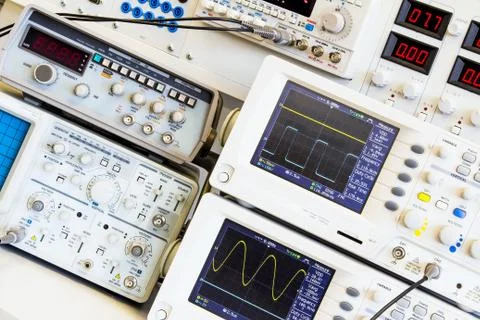 Two digital oscilloscopes for measuring table Stock Photos