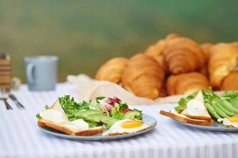 Two dinner plates on table outdoors. Stock Photos