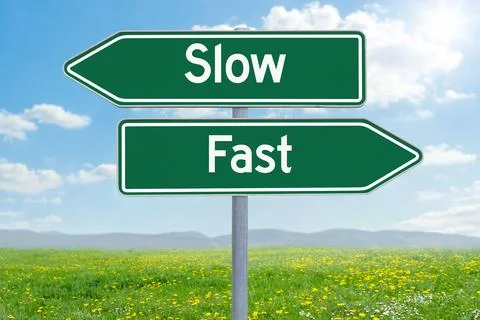 Two direction signs - Slow or Fast Stock Photos