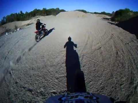 Two dirt bikes jumping together Stock Footage 8931294