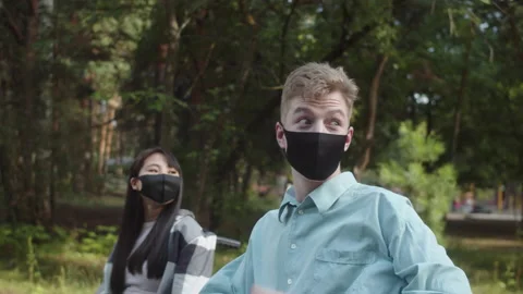 Two disabled friends are walking in the forest, meeting their friends and Stock Footage 174487881