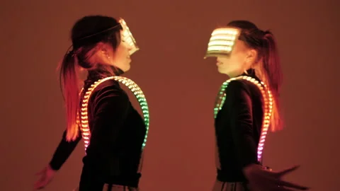 Two  disco dancers move in UV costumes. Stock Footage 147624733