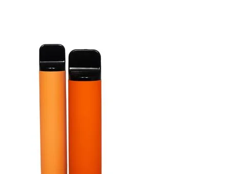 Two disposable e-cigarettes. The concept of modern smoking, vaping and nicoti Stock Photos
