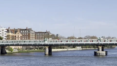 Two District Line Trains Crossing Putney Bridge London 4K Video stock 332651688