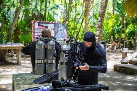 Two divers preparing to dive. Cylinders for diving. Cave diving. Mexico Stock Photos