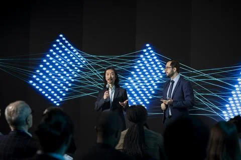 Two diverse IT technicians presenting new LLM systems with suggestions Stock Photos