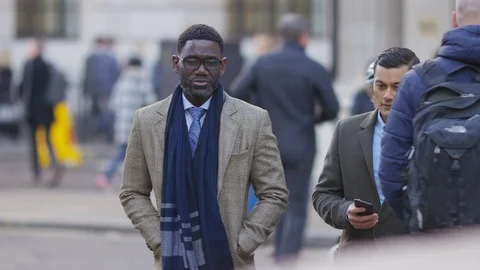 Two diverse professional colleagues walking and talking in the city Video stock 97980580