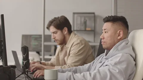 Two Diverse Software Developers Working in Office Stock Footage 172192650