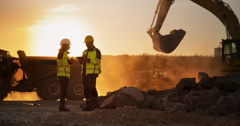Two Diverse Workers Using Tablet On Construction Site Stock Footage 256042317
