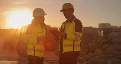 Two Diverse Workers Using Tablet On Construction Site Stock Footage 256042481