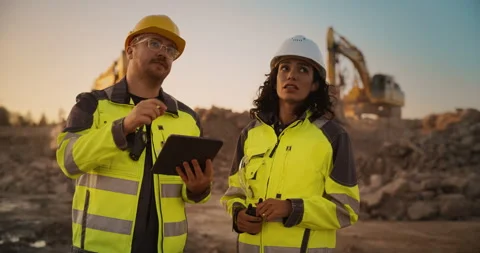 Two Diverse Workers Using Tablet On Construction Site Stock Footage 256042795