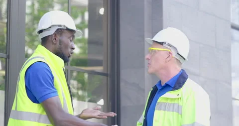 Two diversity senior industry engineer successful shake hands in safety unifo Video stock 150417135