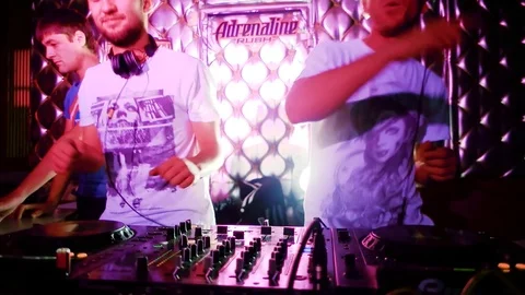Two DJ Man near the remote control the music at the party moving knobs and 스톡 동영상 72214759