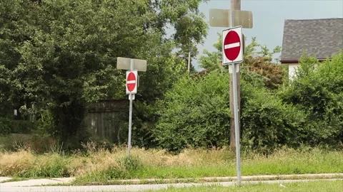Two do not enter road street signs, one in foreground Stock Footage 246610839