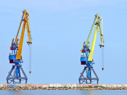 Two dock cranes. Stock Photos