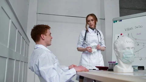 Two doctors argue whether the mask helps to protect against viral infections Stock Footage 126750885
