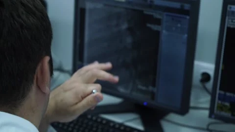  two doctors check patient studies on computer Stock Footage 130648424
