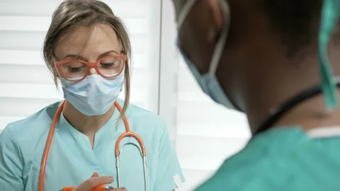 Two doctors discuss the problems of treating a patient. Concept of the absence Stock Footage 133596732