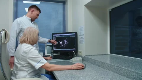 Two doctors discussing an MRI scan Stock Footage 153131243