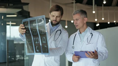 Two Doctors Discussing a Patient's X-Ray Video stock 280976215