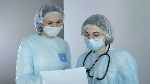 Two doctors discussing results of the analysis Stock Footage 151651973