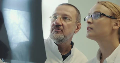 Two Doctors Discussing an X-Ray Picture Stock Footage 52390866