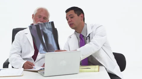 Two doctors discussing x-rays and notes Stock Footage 67354942