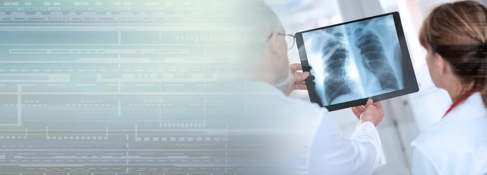 Two doctors examining x-ray report; panoramic banner Stock Photos