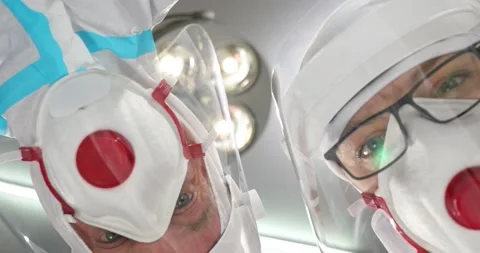 Two doctors holding medical instruments in the emergency room. Medical specia Stock Footage 152858433