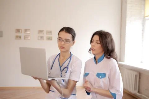 Two doctors with laptop Stock Photos