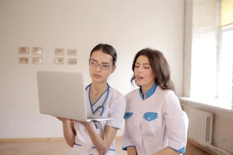 Two doctors with laptop Stock Photos