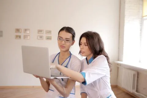Two doctors with laptop Stock Photos