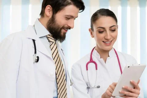 Two doctors looking at digital tablet Stock Photos
