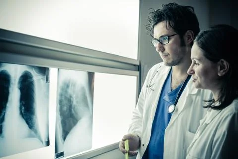 Two doctors making a diagnosis Stock Photos