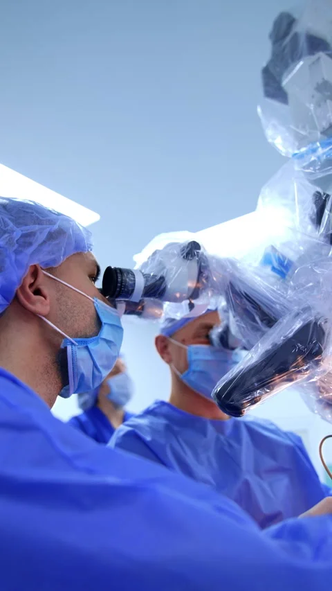 Two doctors in masks look at microscope. Stock Footage 308096018