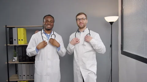 Two doctors at office clinic put a stethoscope around the neck Stock-Footage 276224568