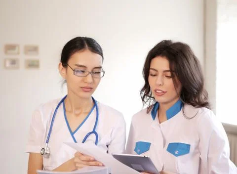 Two doctors with paper documents Stock Photos