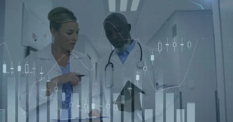Two doctors pausing in hospital reviewing tablet consulting semi-transparent Stock Footage 332281286