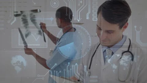Two doctors reviewing X-rays, left moving films sparking HUD, right taking notes Stock Footage 330356163