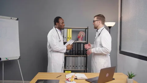 Two Doctors Shake Hands at office of medical clinic Video stock 264979476