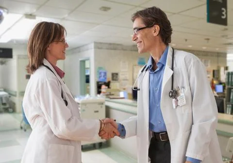 Two doctors shaking hands Stock Photos