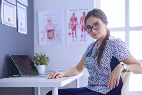 Two doctors speaking in a bright office Stock Photos