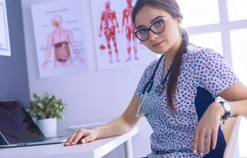 Two doctors speaking in a bright office Stock Photos