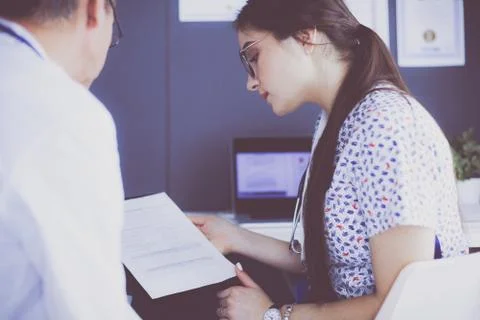 Two doctors speaking in a bright office Stock-Fotos
