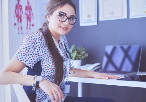 Two doctors speaking in a bright office Stock Photos